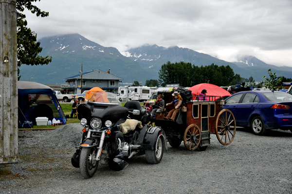 motorcyle pulling a stagecoach and dolls